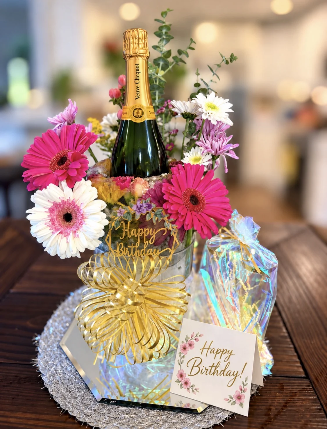 Bougie Bloom with Veuve Clicquot Champagne and pink flowers