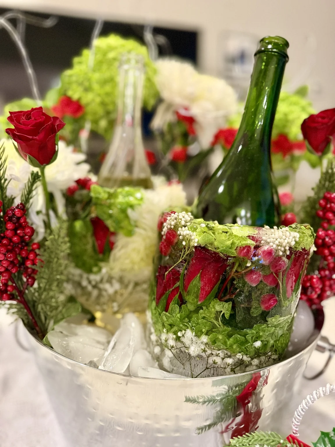 Red roses, white flowers and green hydrangeas in two floral ice chillers